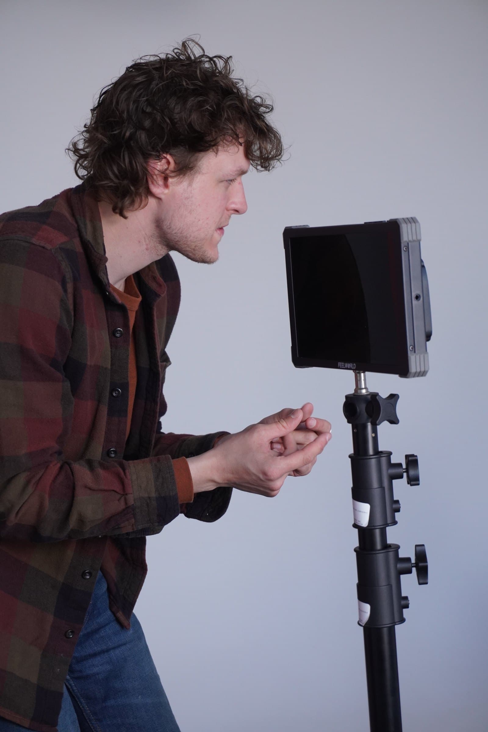 A crew member checking a shot on the monitor
